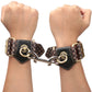 The vintage style bronze spikes of the rebellion reign handcuffs