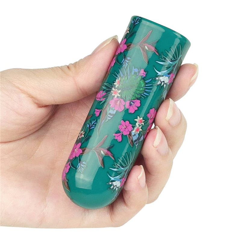 A woman holds the rechargeable antheia massager