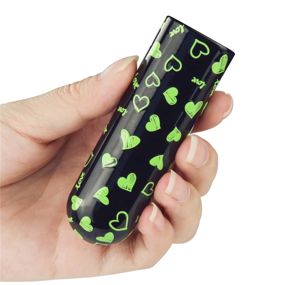 A man holds the glow in the dark heart vibrator