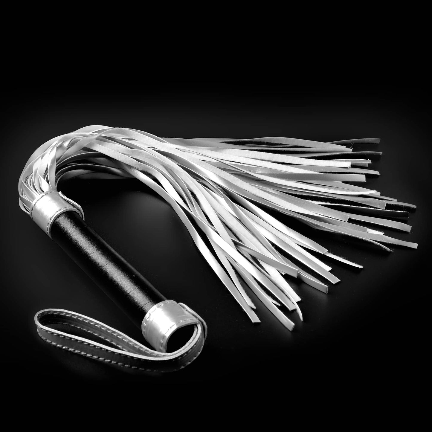The bdsm sex whip flogger for kinky play exudes charm with its blend of black and silver