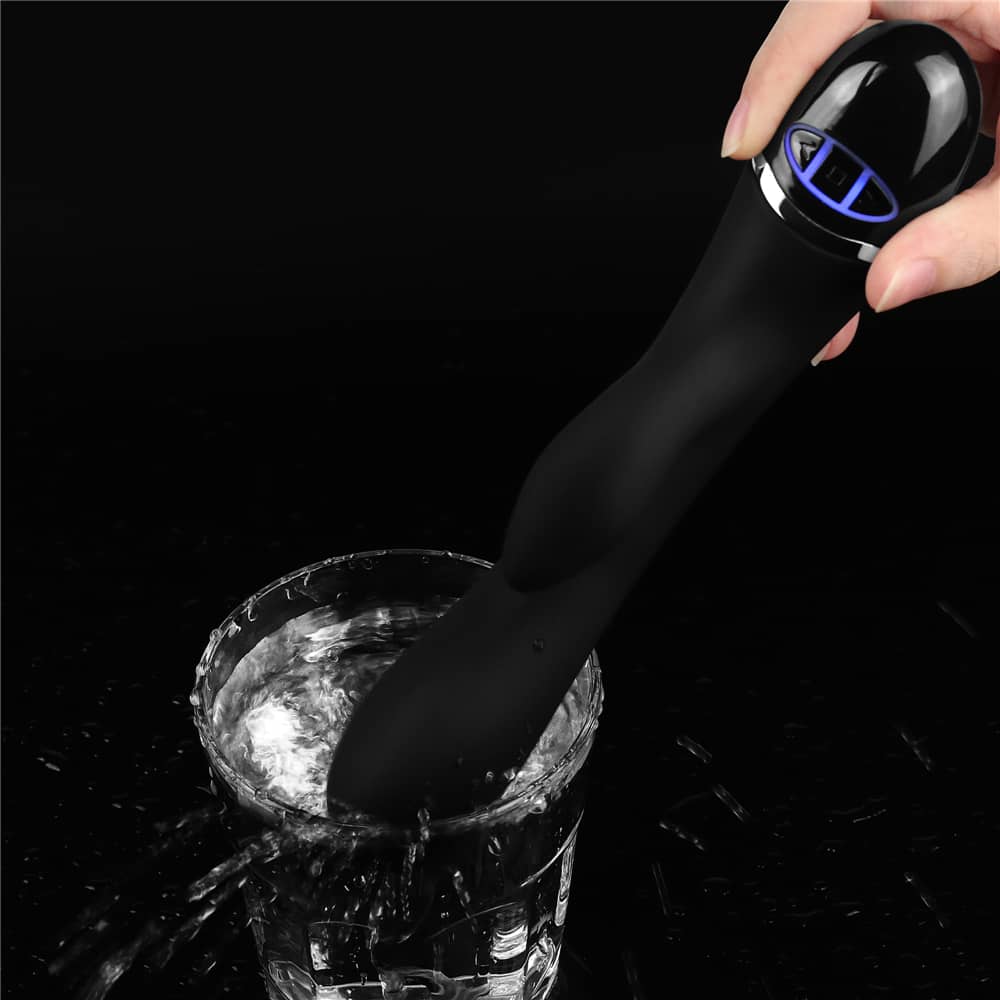 The silicone clit duo finger vibrator is vibrating on the water