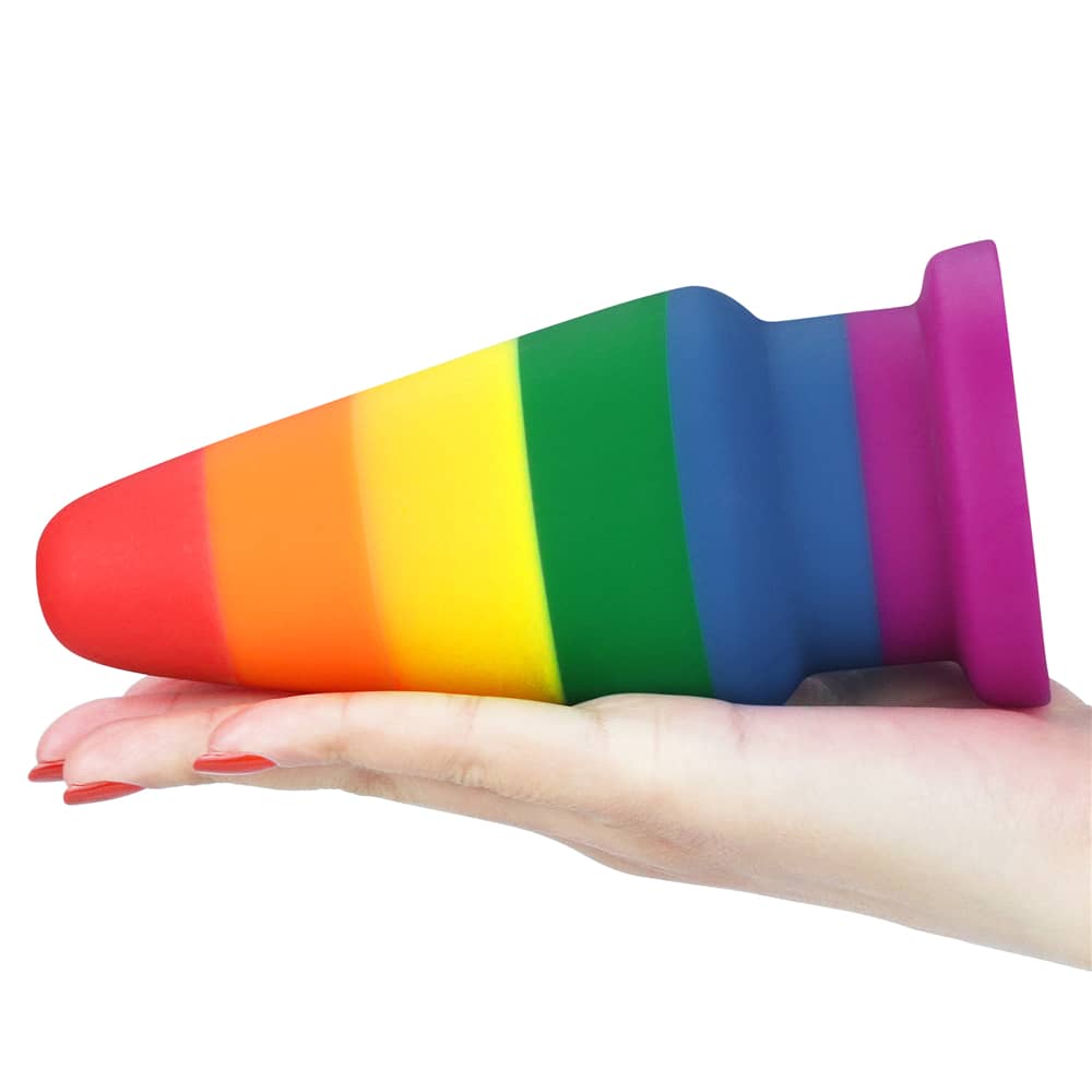 The silicone rainbow butt plug anal toy lays flat