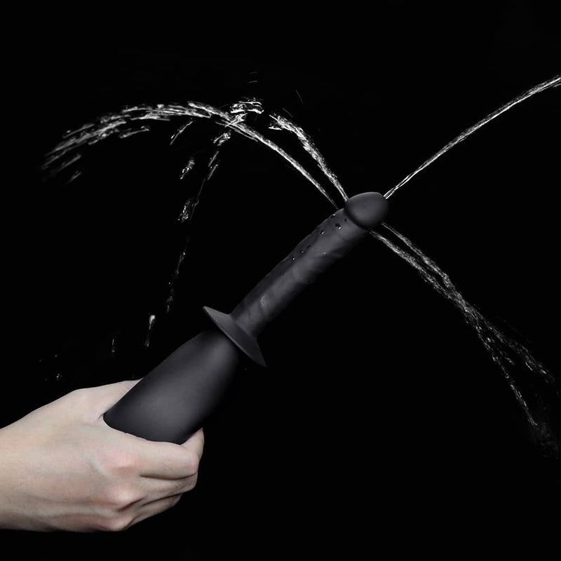 Water squirts from the silicone soft deluxe anal douche