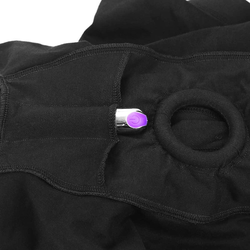 The mini vibrator is put in a hidden pocket at the bottom of the strap on boxer