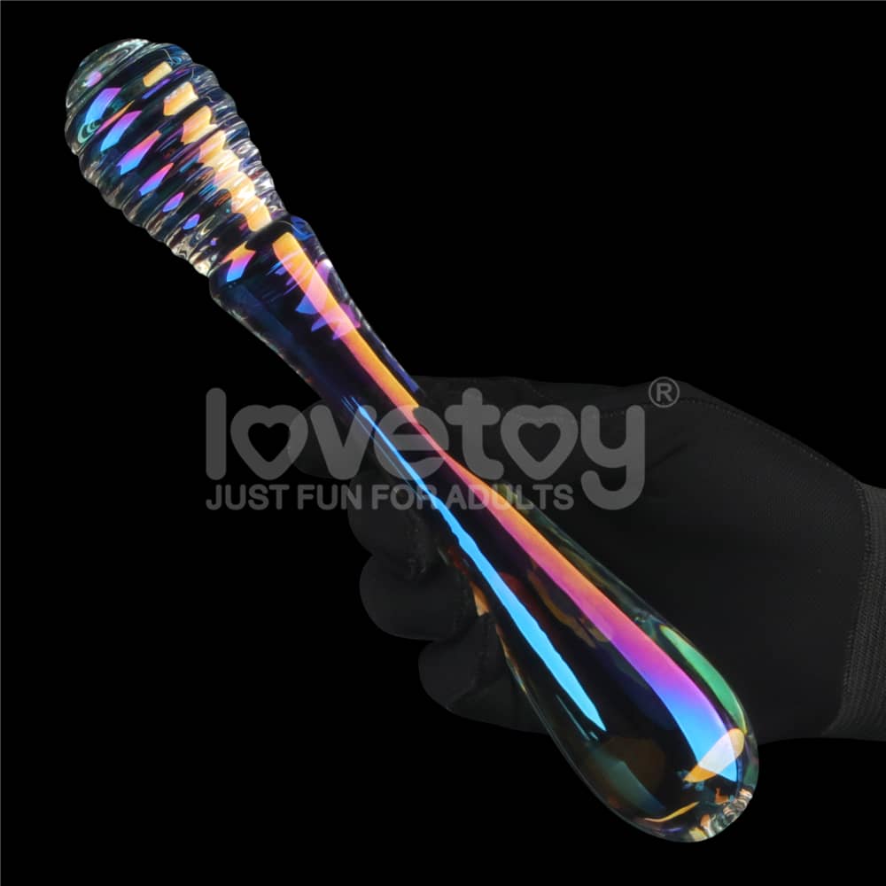 A man holds the twilight gleam twin pleasures glass dildo