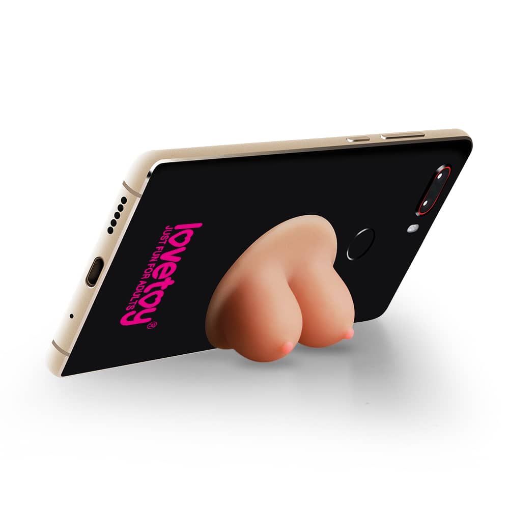 The universal boobie stand holder holds the phone