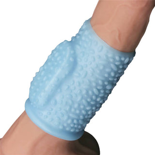 The blue vibrating drip knights ring worn on dildo