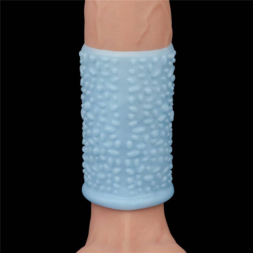 The blue vibrating drip knights ring worn on a upright dildo