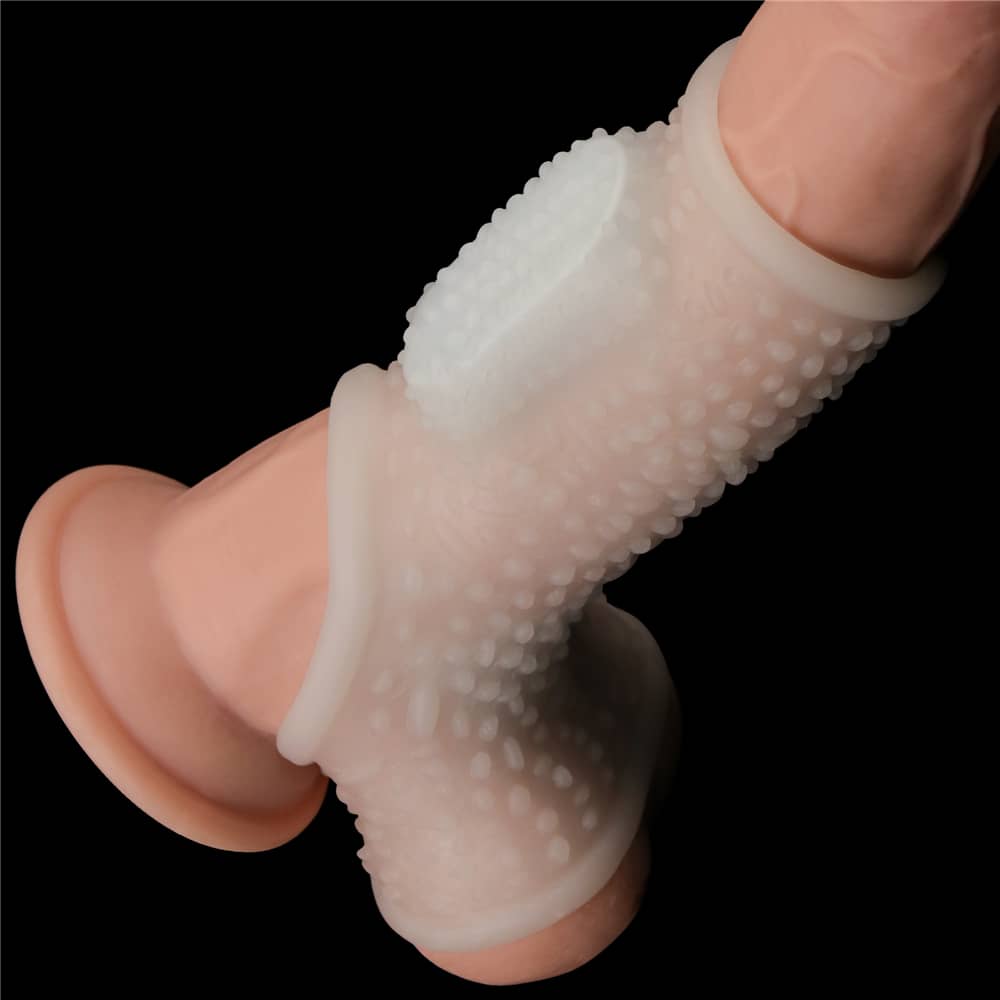 The vibrating drip cock sleeve with scrotum sleeve cuddles the dildo