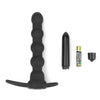 The vibrating rock balled double prober anal beads lays flat with its vibrator