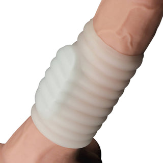 The vibrating penis sleeve worn on dildo with a video playback logo