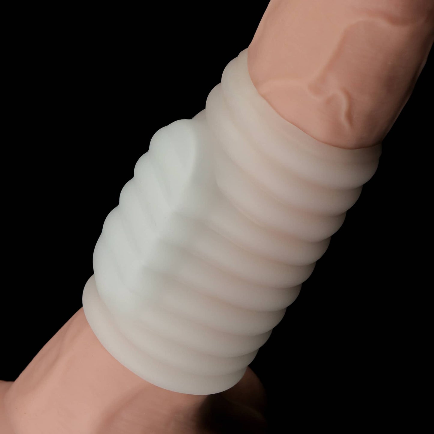 The wave vibrating penis sleeve cuddles the dildo with its comfortable wrapping