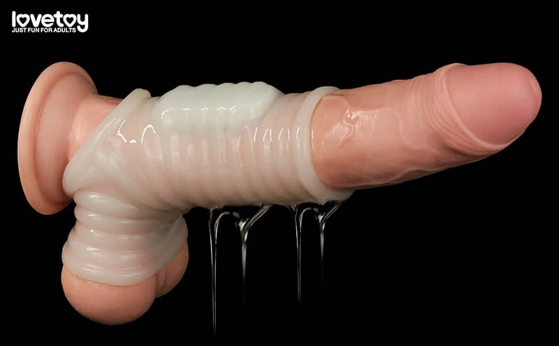 The wave vibrating knights ring with scrotum sleeve worn on dildo with lube