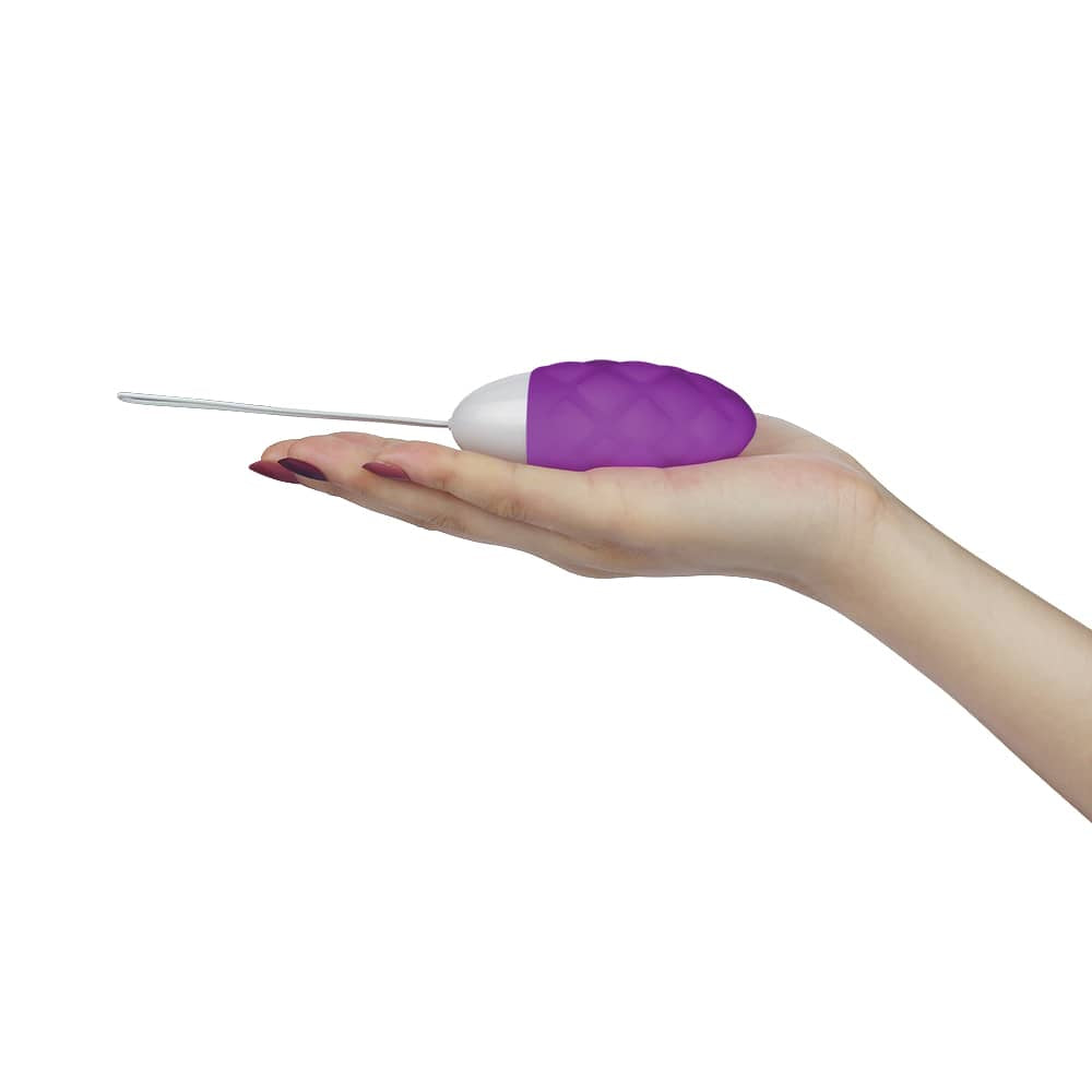 The purple wireless remote control rechargeable vibrator lays flat on the palm