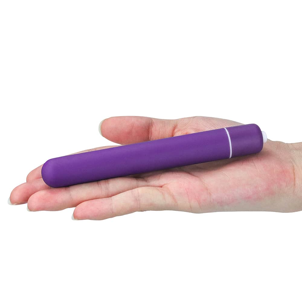 The purple x-basic bullet 10 speeds vibrator lays flat on the palm