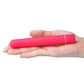 The pink x-basic bullet 10 speeds vibrator lays flat on the palm