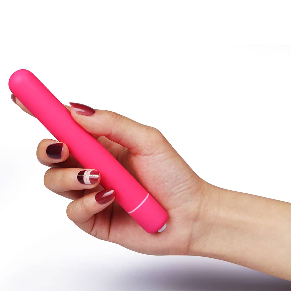 A woman holds the x-basic bullet 10 speeds vibrator